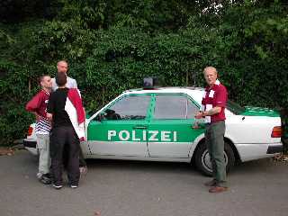 Green and White Polis Car