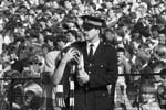 A policeman helps an injured fan after crowd trouble during the Hibs v Hearts Edinburgh derby football match at Easter Road in August 1984. Final score 1-2 to Hearts