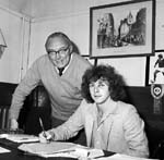 Alfie Conn, sporting a black eye, signs to Hearts football team at Tynecastle in July 1980.