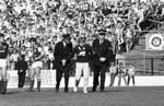 Police eject a fan after crowd trouble during the Hibs v Hearts Edinburgh derby football match at Easter Road in August 1984. Final score 1-2 to Hearts.